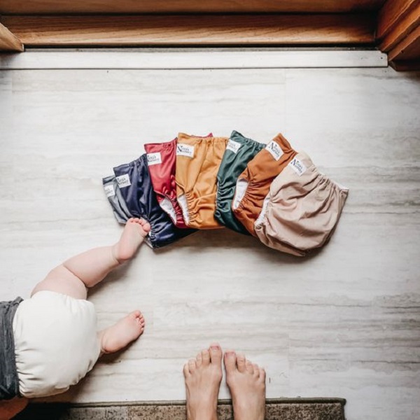 Learn how to effectively clean poop off cloth diapers